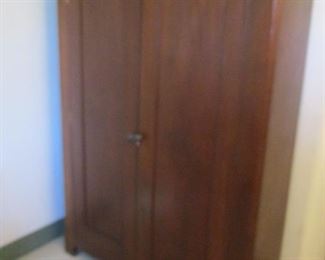 Antique Walnut Wardrobe with long-ago built in shelving.  This one does not break down. 