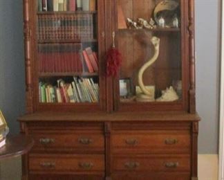 Walnut Bookcase with Drawers.  The glass appears to be aged, maybe original. This piece came from the estate of Ida Pinger, Troy, Kansas.  The top and bottom separate for moving in two pieces.  (Personal items in bookcase are not included.)