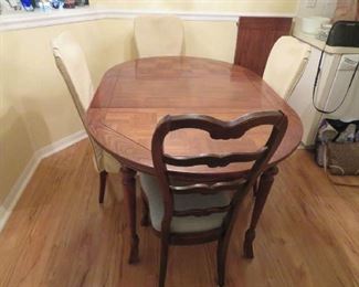 Wood Dining Table With Two Leaves.  Chairs Also Come With Custom Made Covers $100