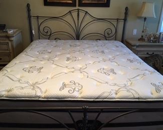 king size (stowaway) mattress and box spring, stowaway meaning the box spring is finished and has storage drawers on each side wrought iron headboard, footboard and frame sold separately 