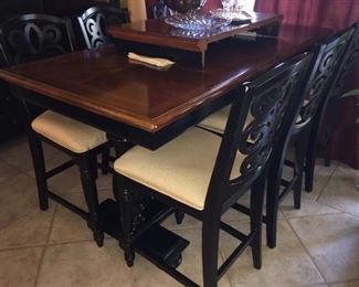 Pub height table with six chairs and extra leaf