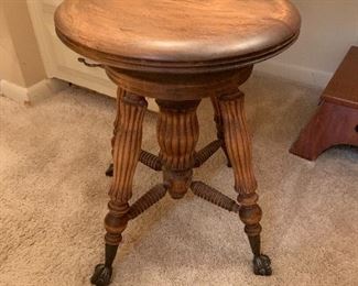 Vintage piano stool with glass ball and claw feet