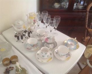 Cups and saucers with glass items