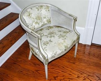 5. Upholstered Armchair with Cane Detail
