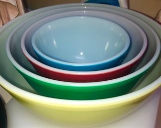 Pyrex.  As an aside I got my set of these bowls from my Grandma about 50 years ago.  Mine have lost a lot of their paint, however I bet I use all of these bowls at least 5 times a week!  