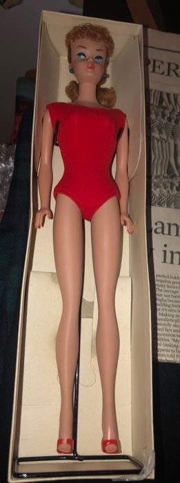 Original Barbie Doll in Original Box.  Pretty great shape except for her green pierced ears.  I know there is a way of removing that; I'll have to research more...