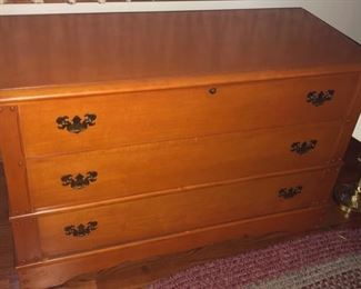 Top Opens and then bottom drawer has storage,  Lane makes a beautiful cedar chest