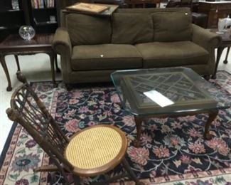 Glass top coffee table; suede sofa