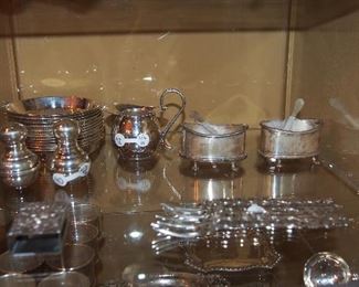 Sterling open salts, matchbox cover, forks, mini creamer, salt and pepper and coasters