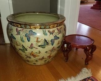 large asian planter with butterflies outside and fish inside