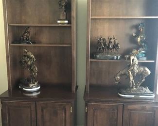 Bronze Remington’s and wood book cases
