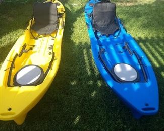 two freedom hawk stand up fishing  kayaks each with electric motor and fish finder