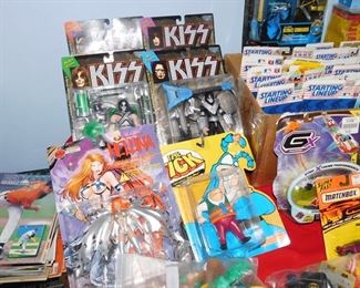 Large collection of Action figures still in package including Spawn, Kiss, X-Files, Batman, Starting Line up, X-Men and more