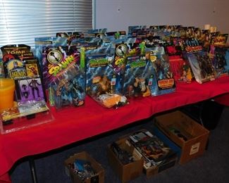 Large collection of Action figures still in package including Spawn, Kiss, X-Files, Batman, Starting Line up, X-Men and more