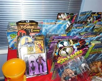 Large collection of Action figures still in package including Spawn, Kiss, X-Files, Batman, Starting Line up, X-Men and more