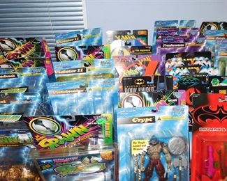 Large collection of Action figures still in package including Spawn, Kiss, X-Files, Batman, Starting Line up, X-Men and more