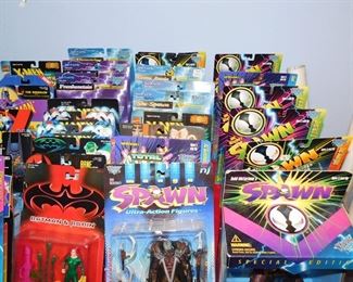 Large collection of Action figures still in package including Spawn, Kiss, X-Files, Batman, Starting Line up, X-Men and more
