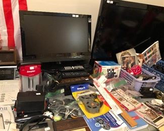 Small flat screen TVs, office supplies, radios, telephones.