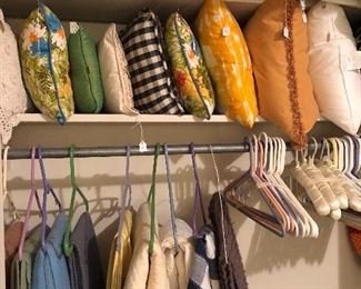 Lots of pillows, blankets, and table linens.