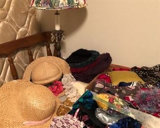 Women's hats, lots of scarves and handmade jewelry keepers.