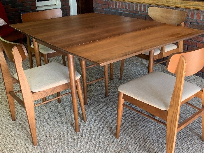 Mid-century dining table with 4 chairs. Excellent condition.
