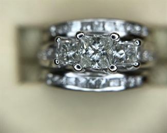 .42 center and 2 .17ct sides with wedding bands 