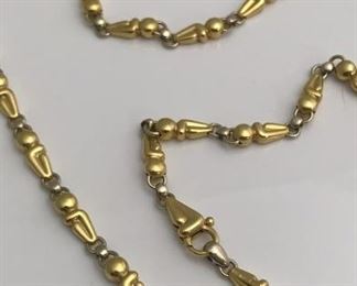 18 K white and yellow necklace weighing over an ounce