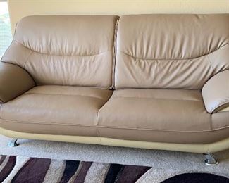 AS-IS Contemporary 2-Tone Leather Blend Loveseat Sofa	36x85x33in	HxWxD
