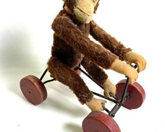 vintage Steiff monkey on bike pull toy