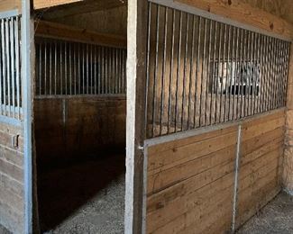three portable horse stalls
