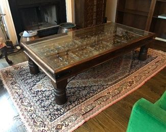 Arabic door converted into glass top coffee table. Measures 34” x 66 1/4” in length x 17 3/4” tall.