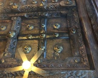 Arabic door converted into glass top coffee table. Measures 34” x 66 1/4” in length x 17 3/4” tall.
