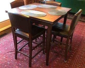 2 pull out leaves. Leaves are 12” each. Table is 36 1/2” square with leaves tucked under. 35 3/4” tall.