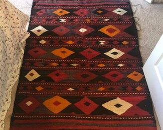 Rug measures 58” (4’ 10”) x 43” (3’7”).