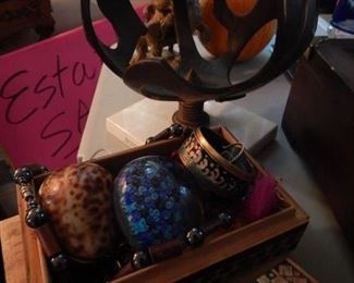 Costume jewelry, paper weight and mid century bronze sphere.