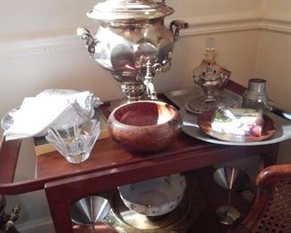 Samovar and other serving items on a mid century tea cart.