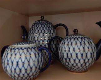 Several tea pots. Russian blue net.