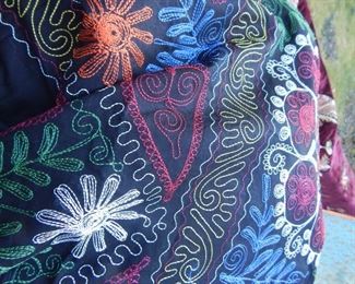 Embroidered fabrics.