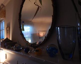 Round gold framed mirror, Paper weights and more.
