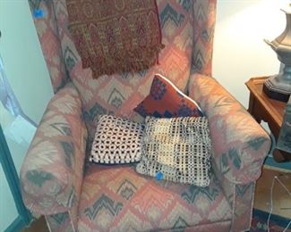 Close-up if wing chair upholstered in flame stitch pattern