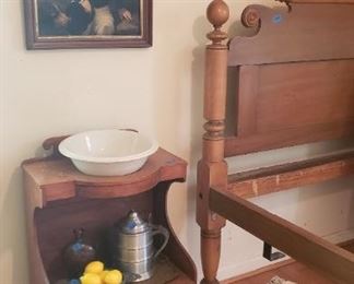 Wash stand with portrait of boy above