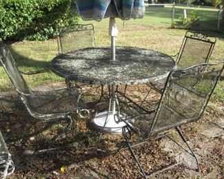 wrough iron table and 4 chairs