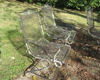 pair of wrought iron spring chairs