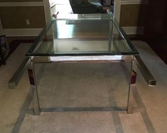 Vintage Milo Baughman style glass and polished stainless steel dining table with pull out extensions and 2 glass leaves, closed measures 6' by 42" wide and with two leaves a 9' total.
