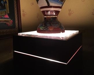 Detail: Laquered wood with lighted acrylic medium pedestal