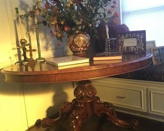 Antique Elliptical table with ornately carved base