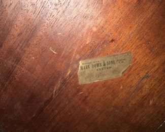 Detail. Underside of table with old British warehouse sticker