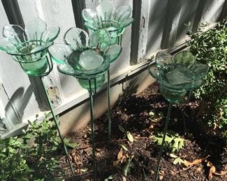 Green glass votive stake  in ground