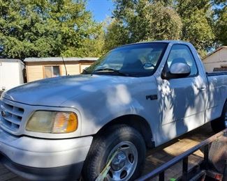 2001 F-150 truck.  Runs great.  Only on trailer for transport to auction site.