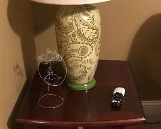 We have a pair of matching end tables. Nice green lamp 